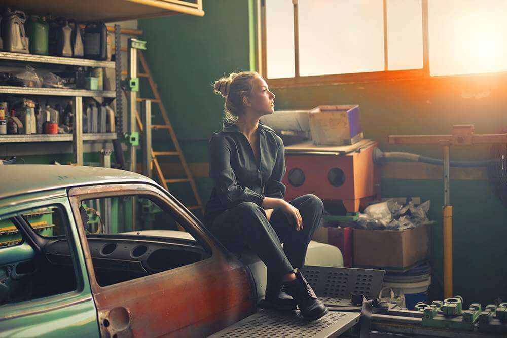 someone sitting with stuff in a garage